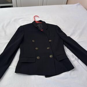 Heavier black blazer. Two functional pockets in front.